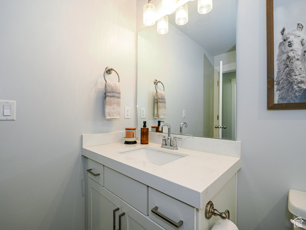 Bathroom featuring vanity and toilet