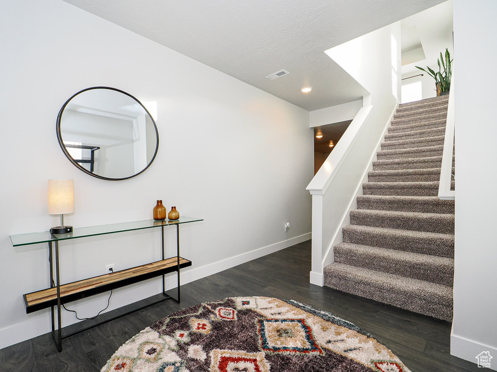 Interior space featuring dark wood-type flooring