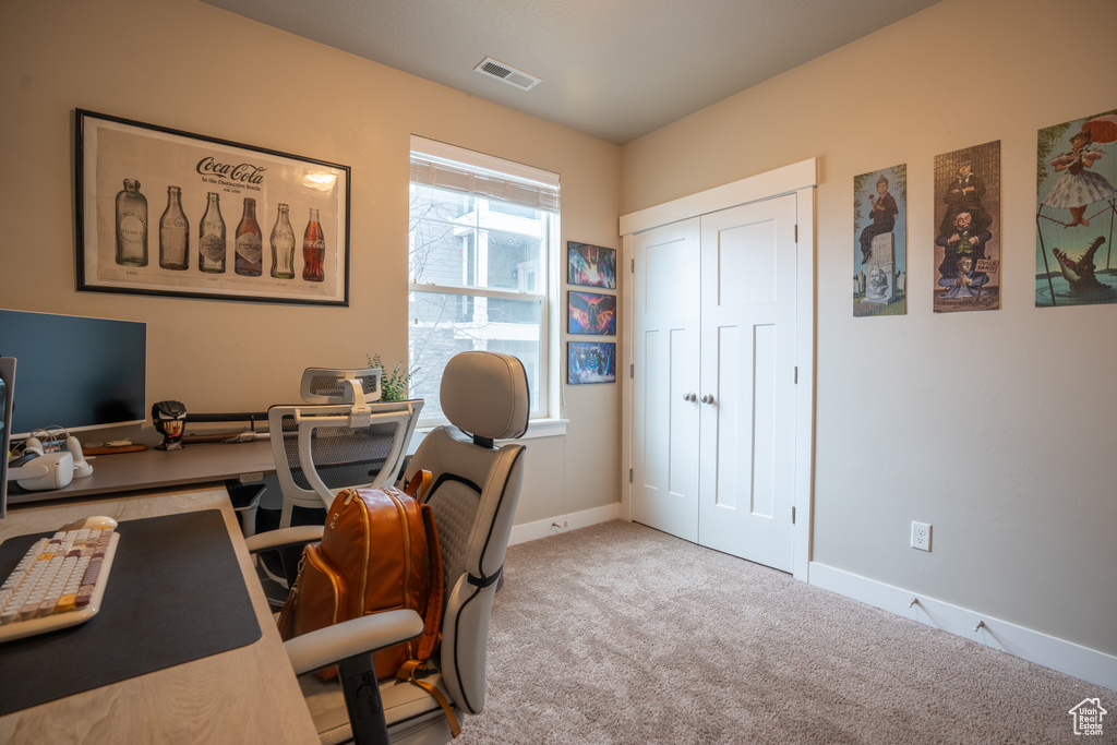 Office featuring light colored carpet