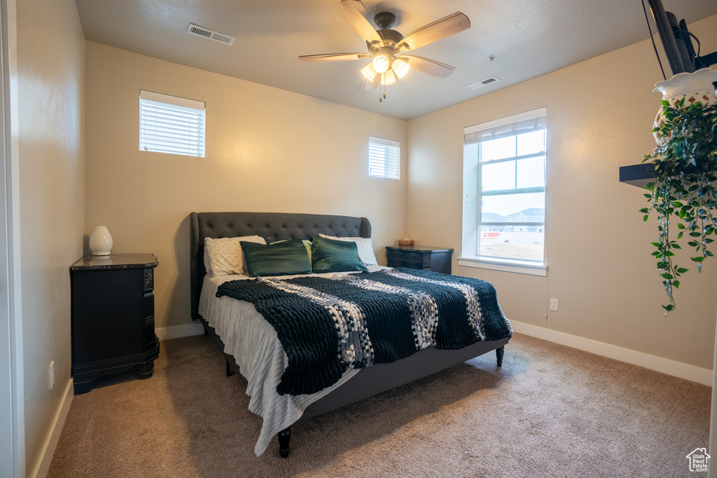 Bedroom with carpet flooring and ceiling fan