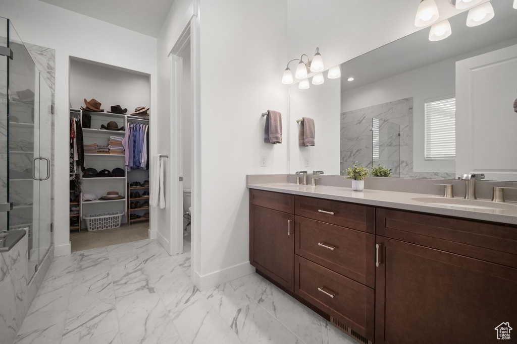 Bathroom with vanity and an enclosed shower