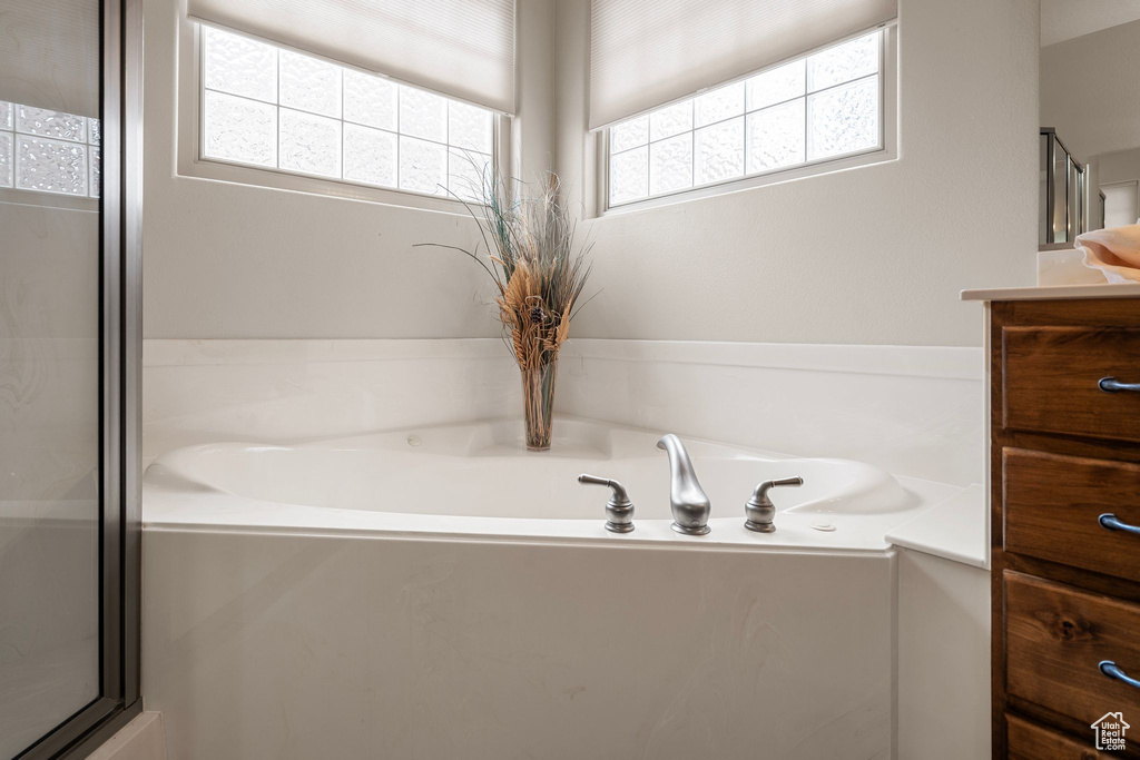 Bathroom with vanity and shower with separate bathtub