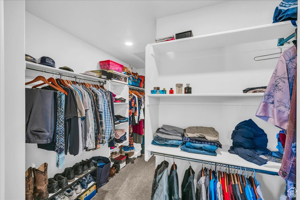 Walk in closet featuring carpet flooring
