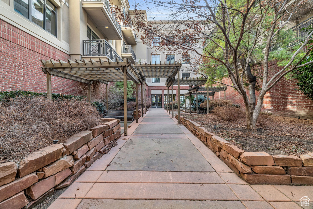 View of property\\\\\\\'s community featuring a pergola