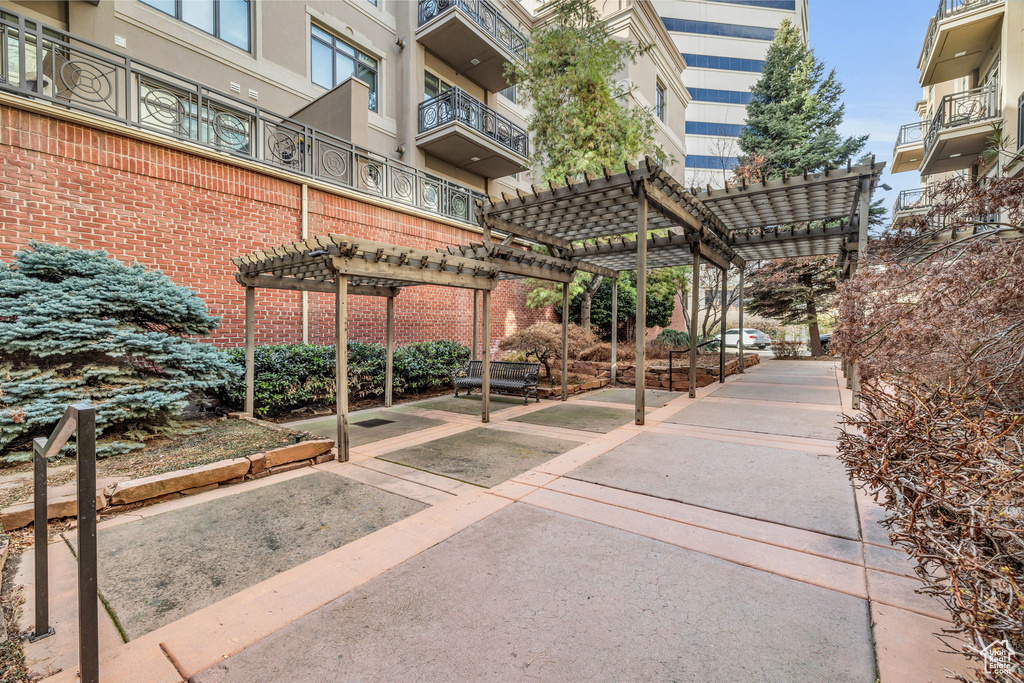 View of property\\\\\\\'s community featuring a pergola