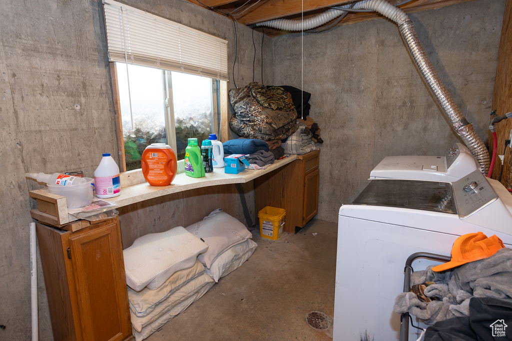 Laundry room featuring washer and clothes dryer