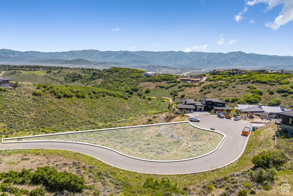View of property location with a mountain backdrop and property boundaries highlighted