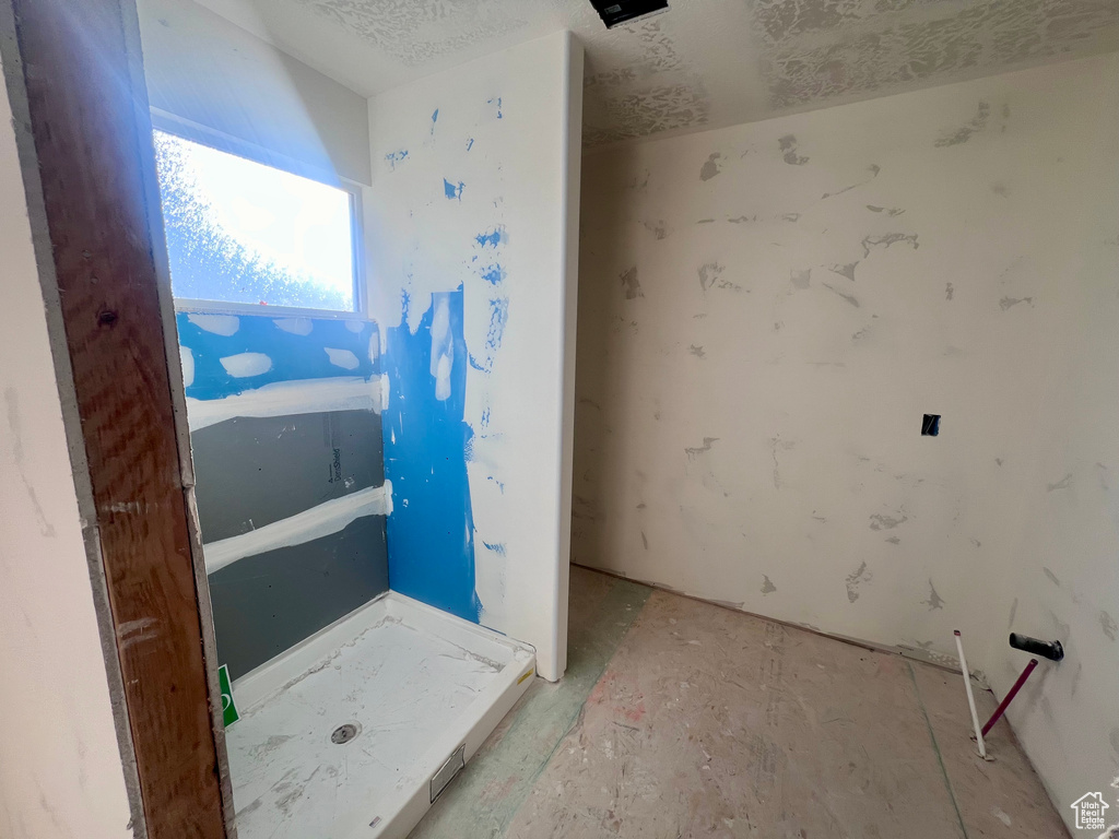 Bathroom featuring a textured ceiling