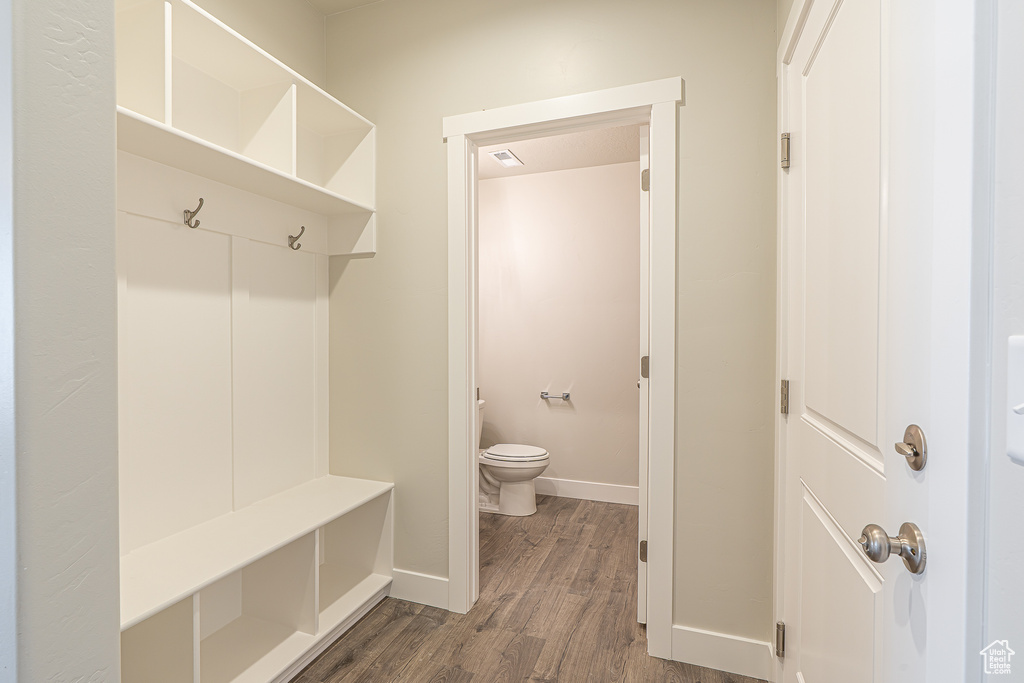 Mudroom featuring baseboards, visible vents, and dark wood-type flooring