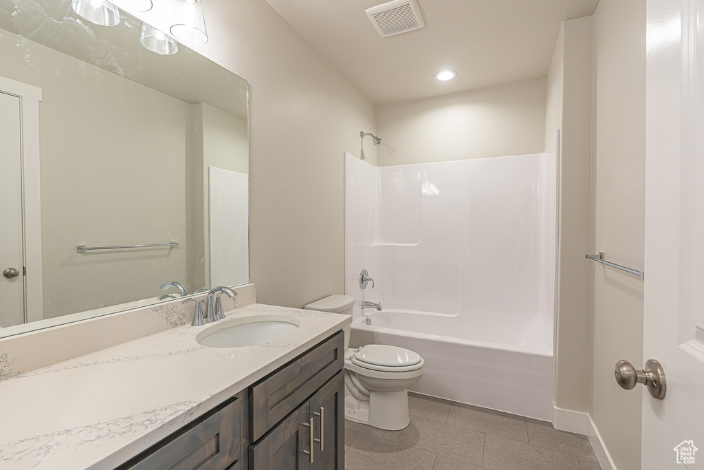 Full bath featuring vanity, toilet, recessed lighting, tub / shower combination, and visible vents