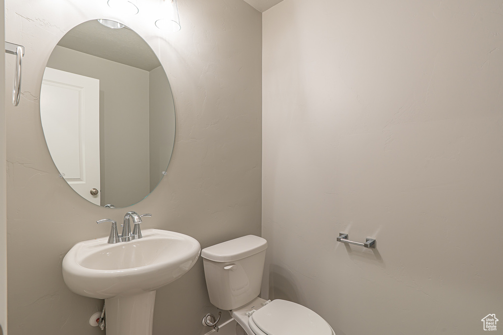Bathroom featuring a sink and toilet