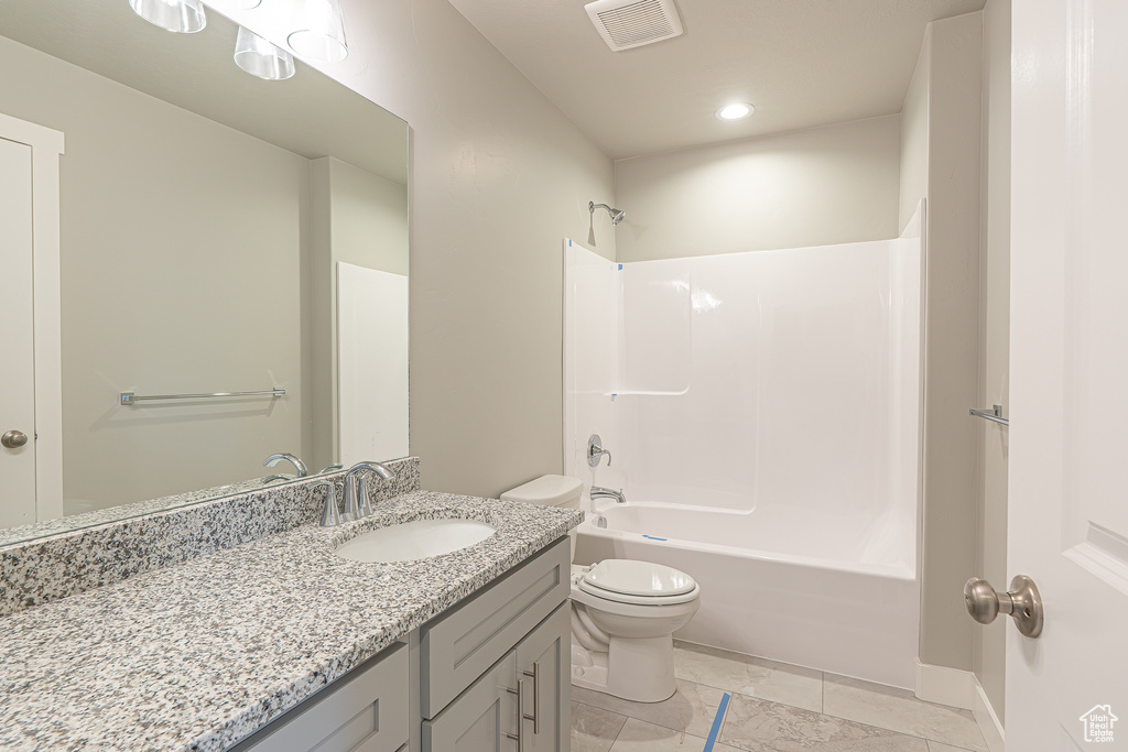 Bathroom with visible vents, vanity, toilet, recessed lighting, and shower / bathing tub combination