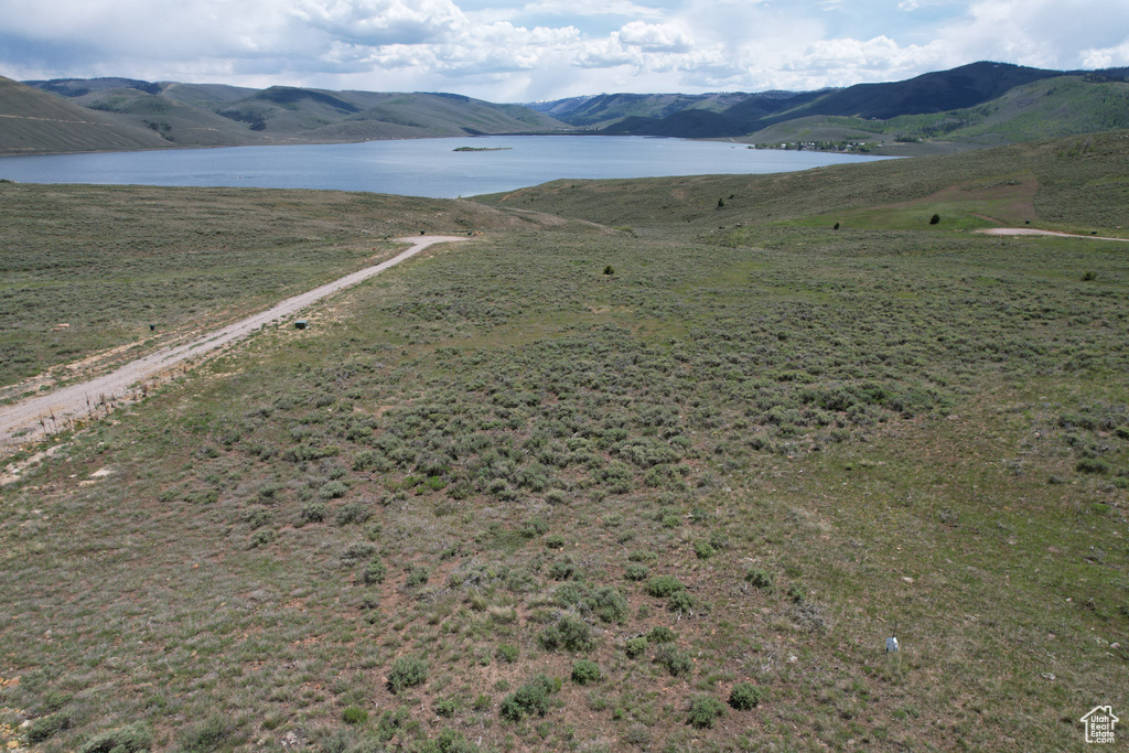 View of mountain backdrop with a large body of water