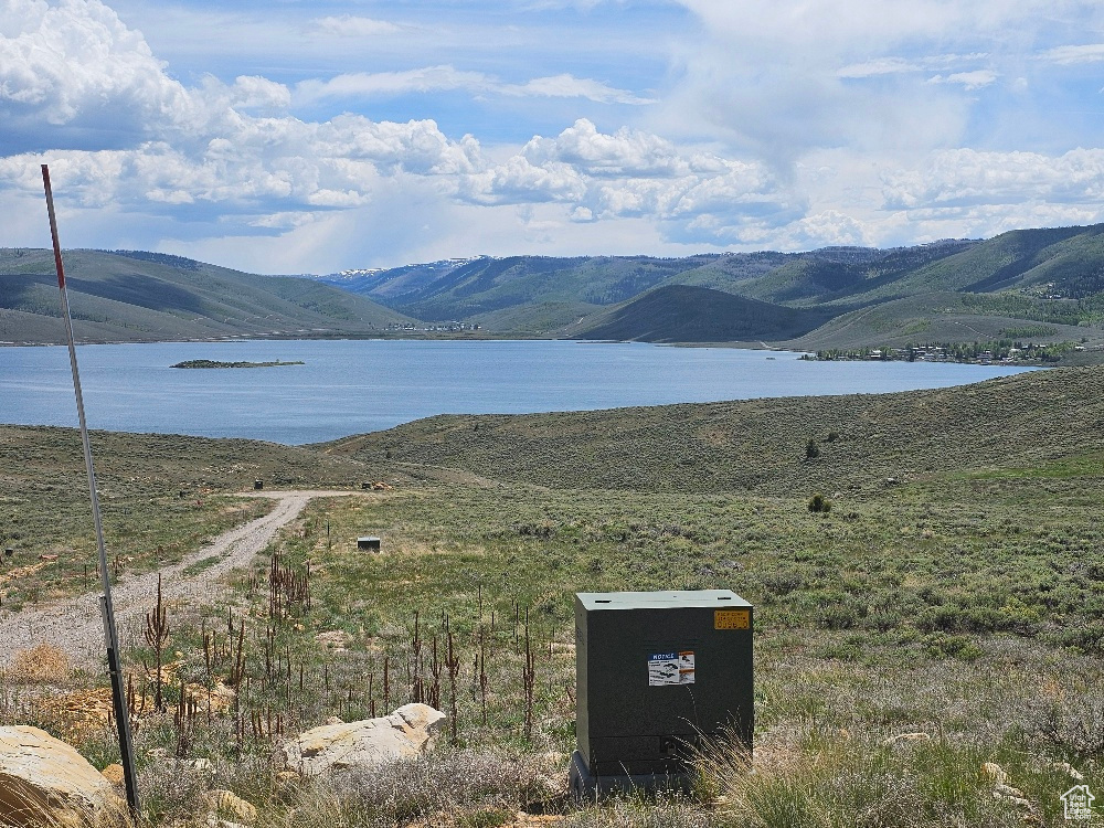 Mountain view featuring a nearby body of water