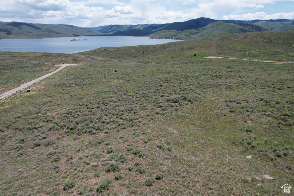 View of mountain backdrop featuring a large body of water