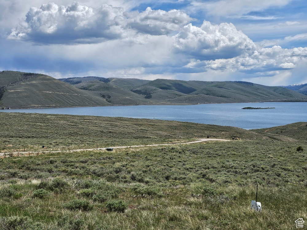 View of mountain backdrop featuring a large body of water