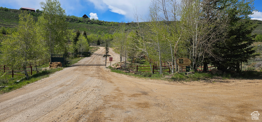 View of street featuring a gate and a view of countryside
