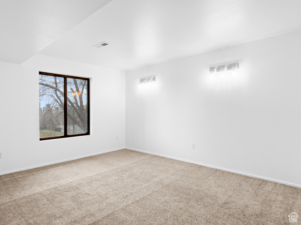 View of carpeted spare room