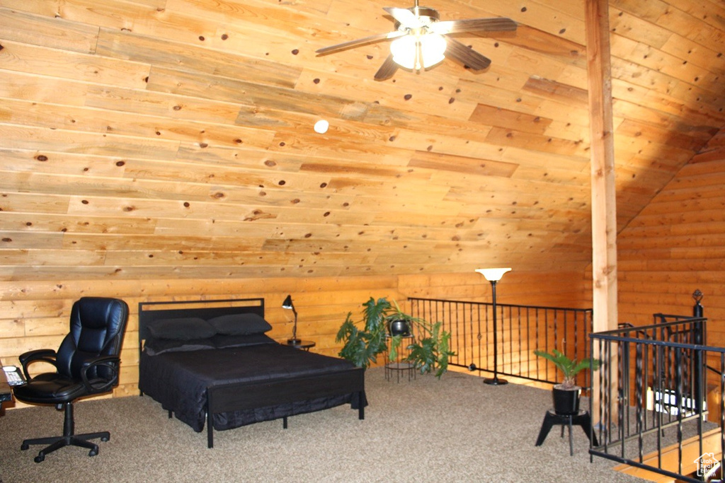 Carpeted bedroom with lofted ceiling and wooden ceiling