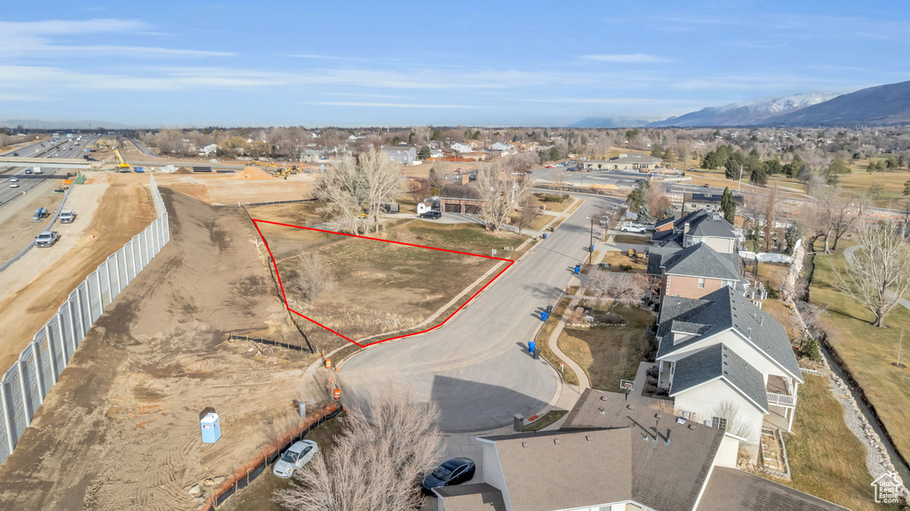 Birds eye view of property with a mountain view