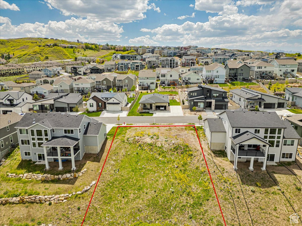 Aerial view of residential area with property boundaries highlighted