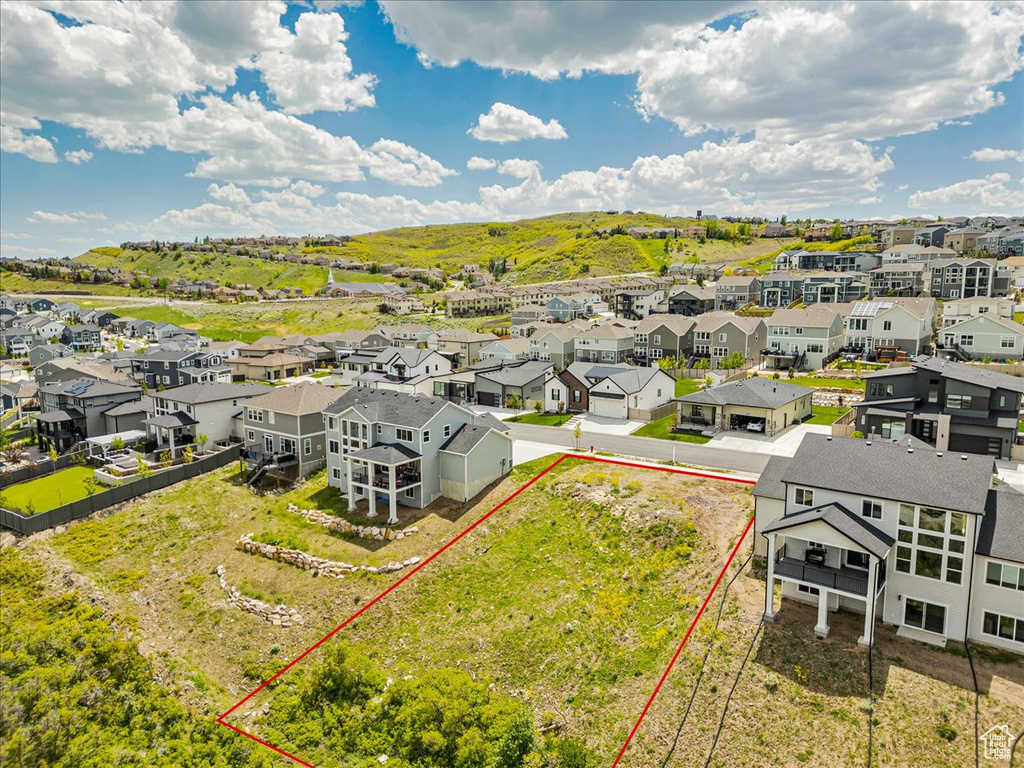 Aerial view of residential area with property boundaries highlighted