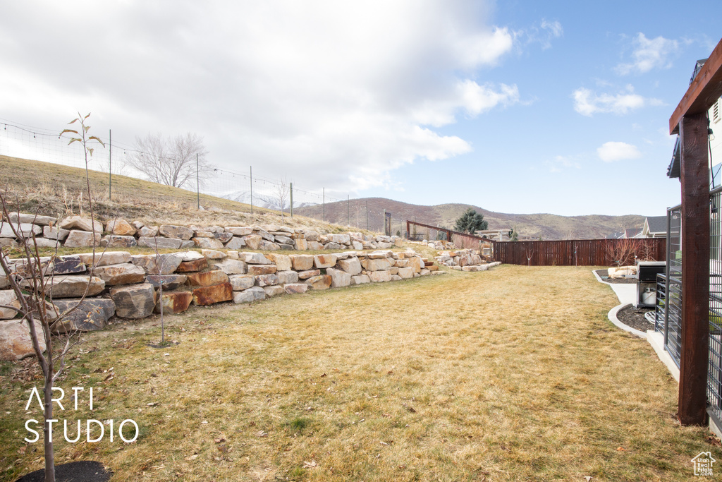 View of yard with a mountain view