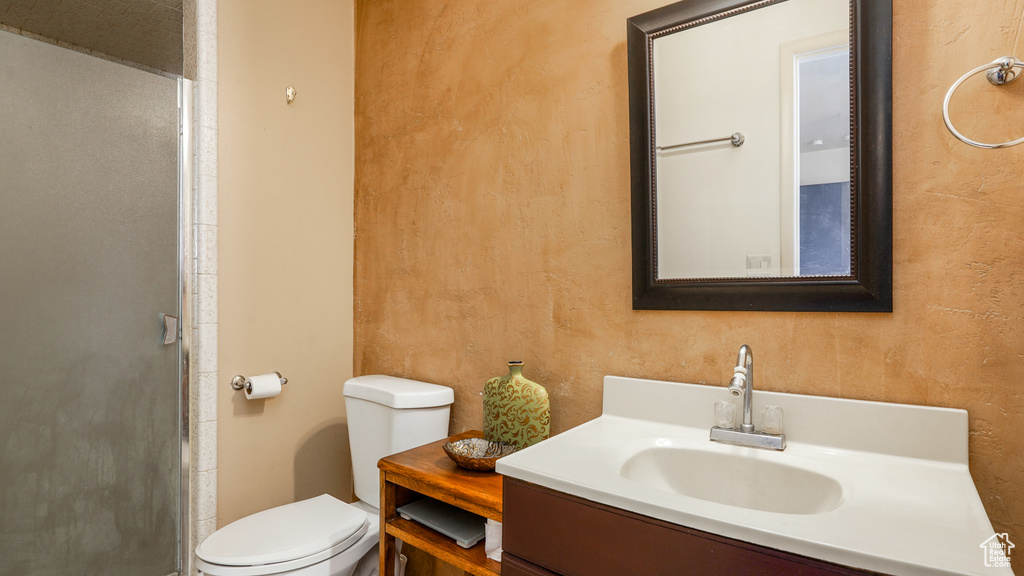 Bathroom with vanity and a shower stall