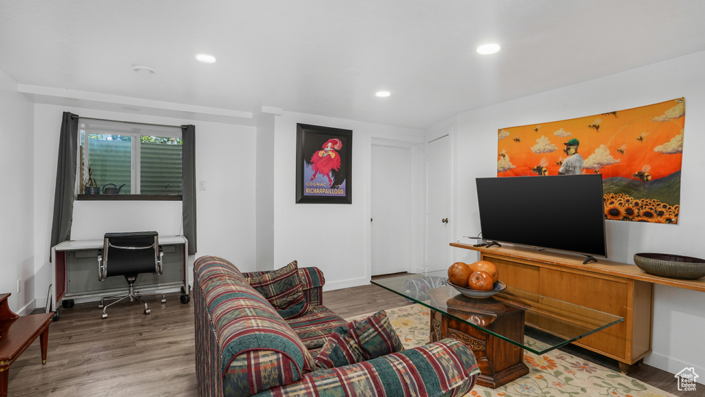 Living room featuring a desk, wood finished floors, and recessed lighting
