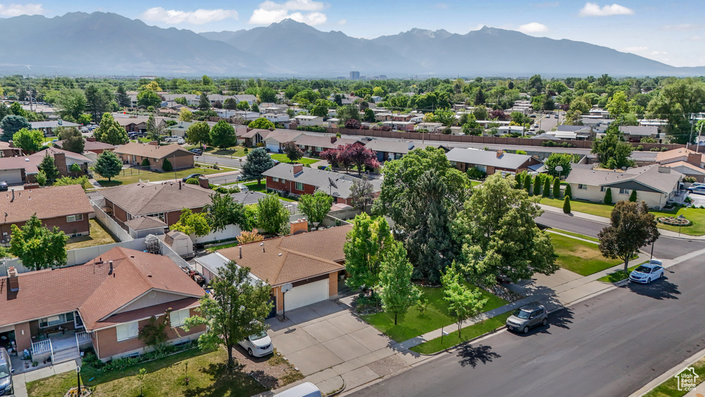 Aerial perspective of suburban area featuring a mountain backdrop