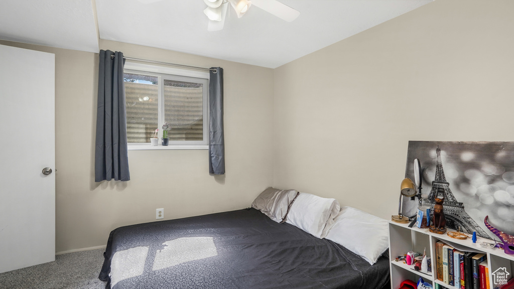 Bedroom with carpet flooring and ceiling fan