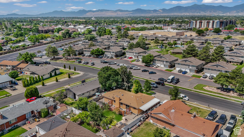 Aerial perspective of suburban area with a mountain backdrop