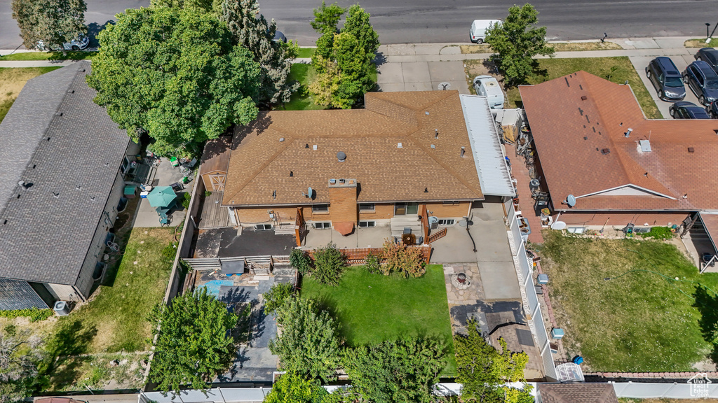 Aerial view of property and surrounding area featuring nearby suburban area
