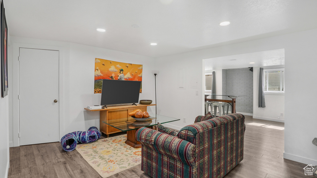 Living room featuring wood finished floors and recessed lighting