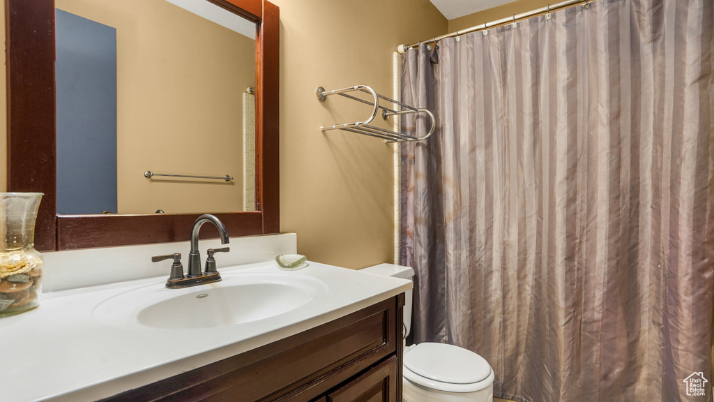 Full bath with vanity and curtained shower