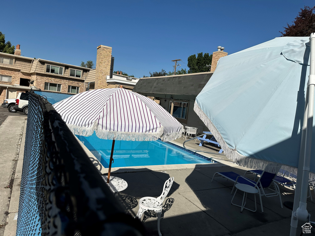 View of swimming pool with a patio