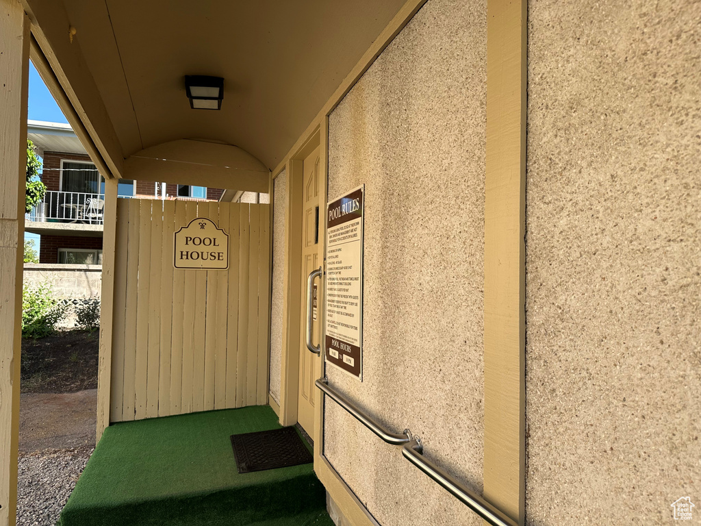 Entrance to property with stucco siding