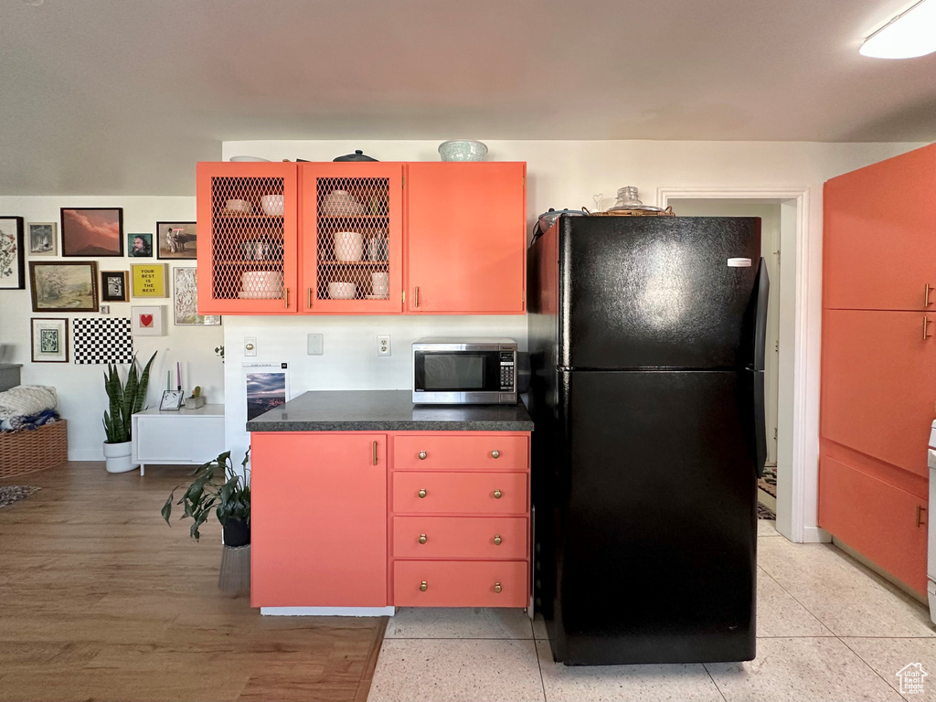 Kitchen with black fridge