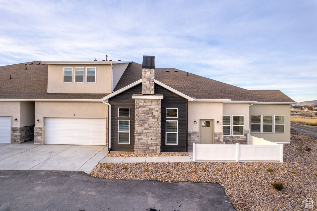 View of front of home featuring a garage