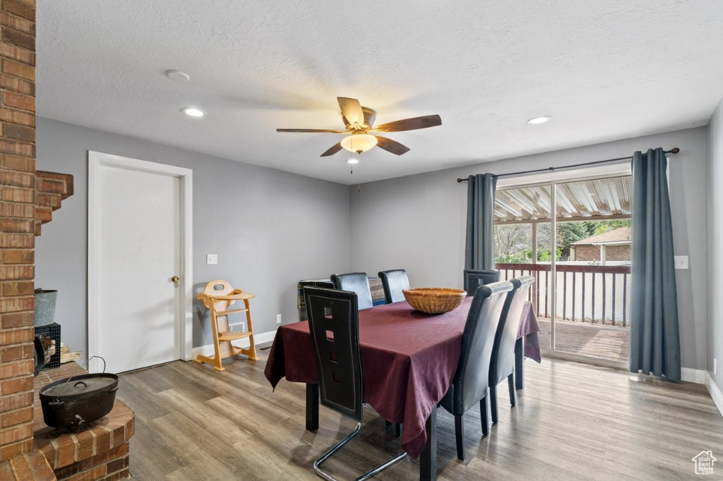 Dining area featuring baseboards, ceiling fan, recessed lighting, and wood finished floors
