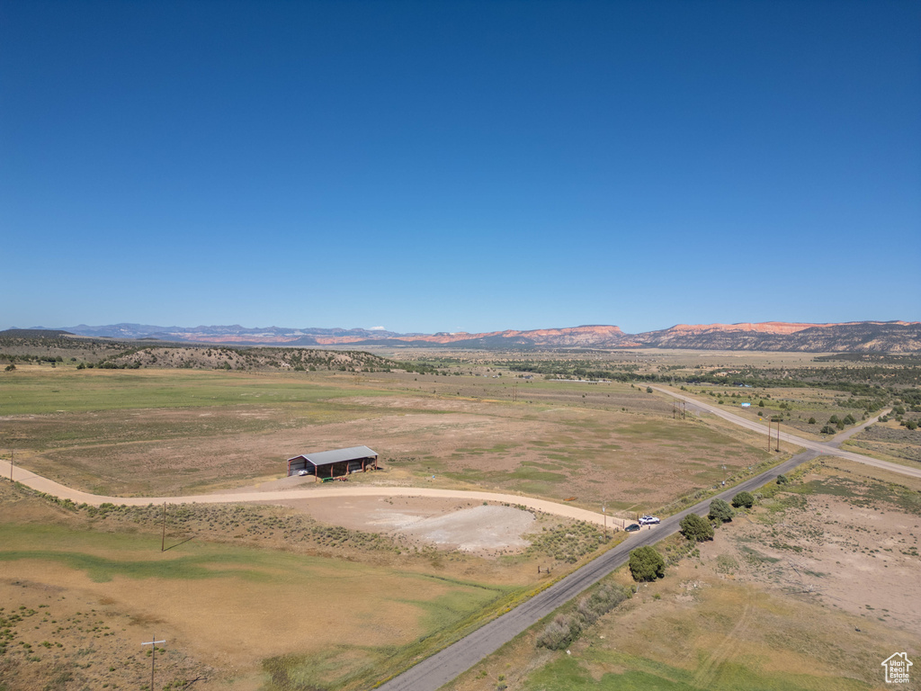Birds eye view of property with a mountain view and a rural view