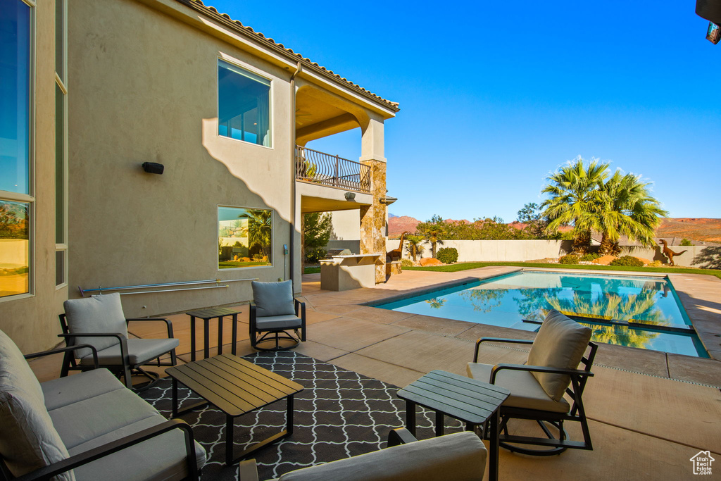 View of swimming pool with a patio