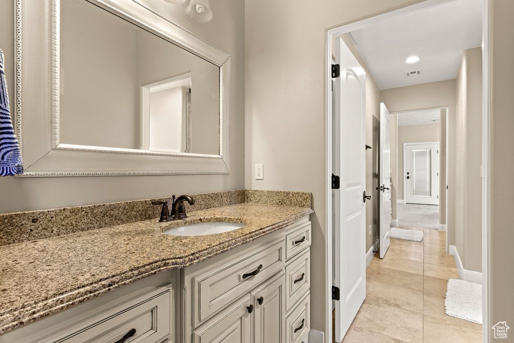 Bathroom with vanity and tile patterned flooring