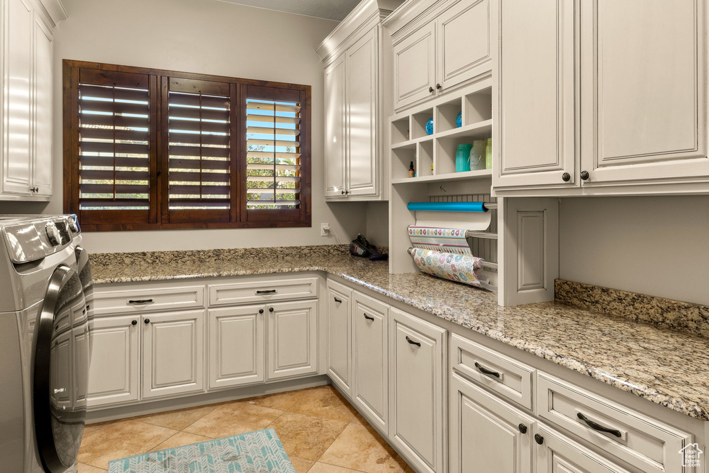 Clothes washing area with independent washer and dryer and cabinets