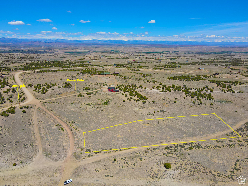 View of rural area featuring property parcel outlined, a desert landscape, and a mountainous background