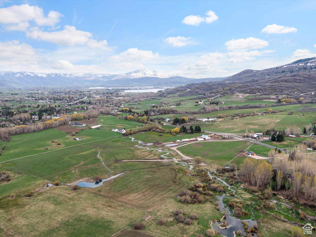 Birds eye view of property featuring a rural view and a mountain view