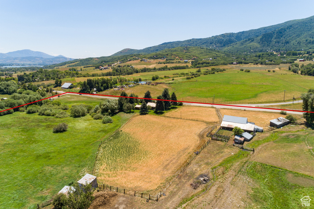 Birds eye view of property featuring a mountain view and a rural view