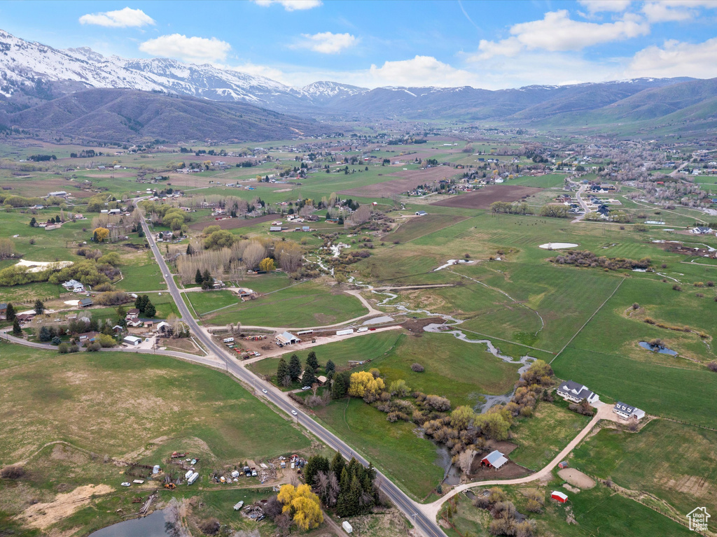 Birds eye view of property with a mountain view and a rural view