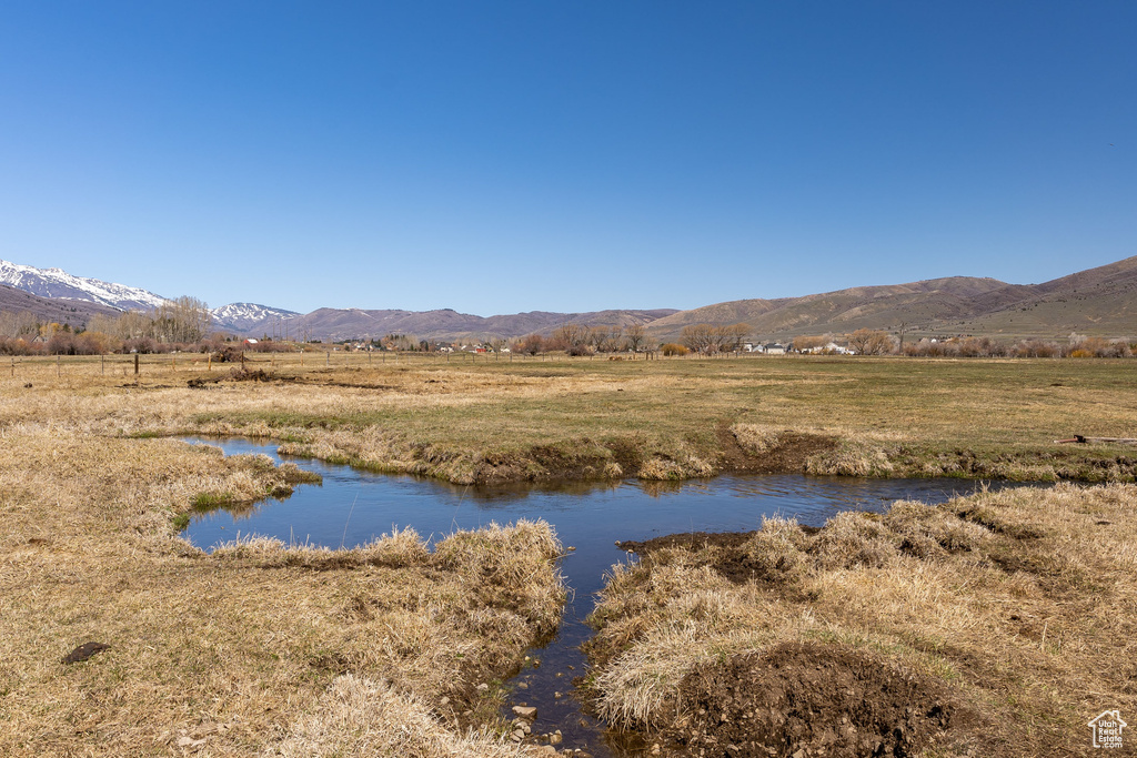 Property view of water featuring a mountain view and a rural view