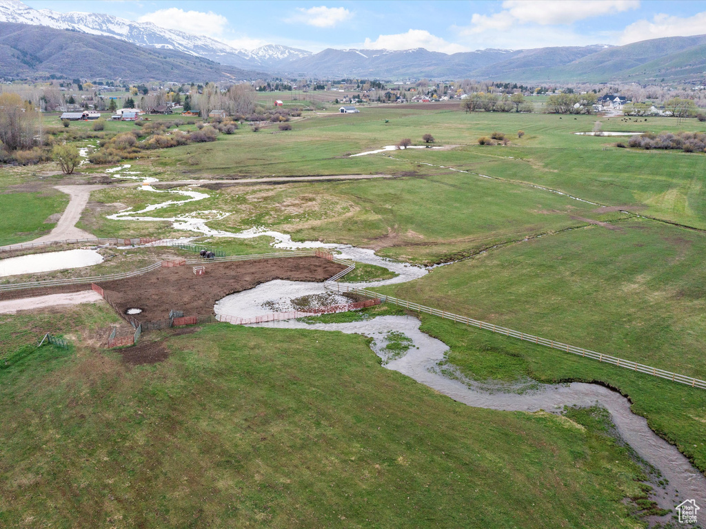 Birds eye view of property with a rural view and a mountain view